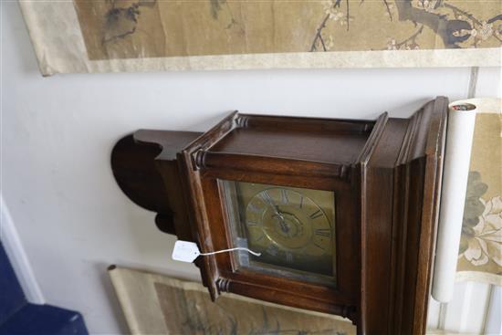 An early 19th century oak cased wall timepiece with alarum, height 31in.